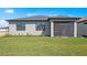 The home's exterior shows a screened patio and manicured lawn with tasteful landscaping at 2748 Winding Creek Trl, North Port, FL 34289