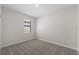 Bedroom with a neutral color palette, carpet flooring, and a window with natural light at 2748 Winding Creek Trl, North Port, FL 34289