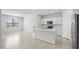 Bright and airy kitchen featuring an island, stainless steel appliances, and plenty of natural light at 2748 Winding Creek Trl, North Port, FL 34289