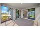 Covered brick lanai providing an open view and access to the interior of the home at 2748 Winding Creek Trl, North Port, FL 34289