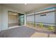 Outdoor lanai with brick floors, screened enclosure, and an open view into the home at 2748 Winding Creek Trl, North Port, FL 34289
