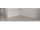 Spacious living room featuring neutral tile flooring and ample natural light at 2748 Winding Creek Trl, North Port, FL 34289