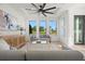 Modern living room with gray sofas, large windows, and a view of the backyard at 2812 N Massachusetts Ave, Tampa, FL 33602