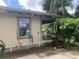 Side view of tan house with vines at 3107 N 24Th St, Tampa, FL 33605