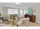 Living room with neutral tones, comfy seating, and a patterned area rug at 3226 Coldwell Dr, Holiday, FL 34691