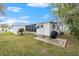 Back of house showing a screened patio and small shed at 34124 Estates Ln, Wesley Chapel, FL 33543