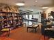 Relaxing community room with library, comfortable seating, and large tables at 34124 Estates Ln, Wesley Chapel, FL 33543