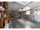 Empty garage with built in shelving and overhead storage at 34124 Estates Ln, Wesley Chapel, FL 33543