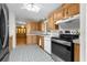 Kitchen with stainless steel appliances and wood cabinets at 34124 Estates Ln, Wesley Chapel, FL 33543