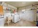 Laundry room with washer, dryer, and utility sink at 34124 Estates Ln, Wesley Chapel, FL 33543