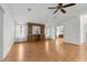 Spacious living room showcasing hardwood floors and built-in shelving at 34124 Estates Ln, Wesley Chapel, FL 33543
