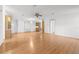 Open living room with hardwood floors and views to dining area at 34124 Estates Ln, Wesley Chapel, FL 33543
