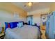 Cozy bedroom with a ceiling fan and comfortable furnishings, including a plush bed at 4001 58Th N St # 20, Kenneth City, FL 33709