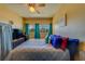 Bright bedroom with a television and comfortable bed, illuminated by natural light at 4001 58Th N St # 20, Kenneth City, FL 33709