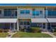 Cozy two-story condo with a well-manicured lawn and inviting front entrance at 4001 58Th N St # 20, Kenneth City, FL 33709