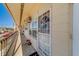 Close view of the condo's front porch, showcasing secure door and natural light at 4001 58Th N St # 20, Kenneth City, FL 33709