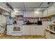 This efficiently designed kitchen features updated appliances and ample counter space for meal preparation at 4001 58Th N St # 20, Kenneth City, FL 33709