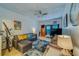 Relaxing living area with a ceiling fan, television, and comfy couches at 4001 58Th N St # 20, Kenneth City, FL 33709