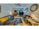 Inviting living room with a cozy couch, accent rug, and natural light at 4001 58Th N St # 20, Kenneth City, FL 33709
