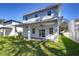 New house with covered patio and grassy backyard at 515 Elm St, Safety Harbor, FL 34695