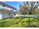 New home with covered patio and grassy backyard at 515 Elm St, Safety Harbor, FL 34695