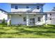 Newly built home featuring a covered patio and a fenced-in backyard at 515 Elm St, Safety Harbor, FL 34695