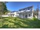 New house with covered patio and grassy backyard at 515 Elm St, Safety Harbor, FL 34695