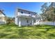 New house with covered patio and grassy backyard at 515 Elm St, Safety Harbor, FL 34695