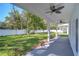Covered patio with ceiling fans and view of fenced backyard at 515 Elm St, Safety Harbor, FL 34695
