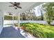Covered patio with ceiling fans and view of fenced backyard at 515 Elm St, Safety Harbor, FL 34695