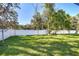 Fenced backyard with lush green grass at 515 Elm St, Safety Harbor, FL 34695