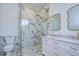 Modern bathroom with marble shower, double vanity, and free-standing tub at 515 Elm St, Safety Harbor, FL 34695
