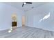 Bedroom with grey floors and access to bathroom at 515 Elm St, Safety Harbor, FL 34695