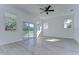 Light and airy bedroom with wood-look floors and access to balcony at 515 Elm St, Safety Harbor, FL 34695
