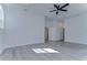 Bright bedroom with wood-look floors and ceiling fan at 515 Elm St, Safety Harbor, FL 34695