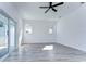 Spacious bedroom featuring wood-look floors and sliding glass doors to balcony at 515 Elm St, Safety Harbor, FL 34695