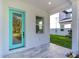 Side view of home showing teal front door and window at 515 Elm St, Safety Harbor, FL 34695