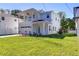 Two-story house with balcony, attached garage, and landscaped lawn at 515 Elm St, Safety Harbor, FL 34695