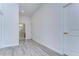 Bright hallway with wood-look floors and access to bathroom at 515 Elm St, Safety Harbor, FL 34695