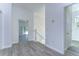 White hallway with wood-look floors and doors to other rooms at 515 Elm St, Safety Harbor, FL 34695