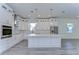 Modern kitchen with white cabinets, large island, and stainless steel appliances at 515 Elm St, Safety Harbor, FL 34695