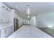 Open concept kitchen features a large island with quartz countertops and white cabinetry at 515 Elm St, Safety Harbor, FL 34695