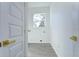 Simple laundry room with white walls, wood-look floors, and a window at 515 Elm St, Safety Harbor, FL 34695