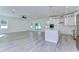 Spacious living room with hardwood floors and access to kitchen and backyard at 515 Elm St, Safety Harbor, FL 34695