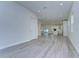 Open living room with grey wood-look floors, and kitchen views at 515 Elm St, Safety Harbor, FL 34695