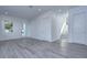 Bright and airy living room with hardwood floors and access to other areas of the home at 515 Elm St, Safety Harbor, FL 34695