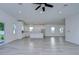 Open concept living room with grey flooring and a view into the kitchen at 515 Elm St, Safety Harbor, FL 34695