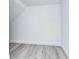 Empty room with white walls and wood-look floors at 515 Elm St, Safety Harbor, FL 34695
