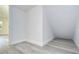 Bright storage area with white walls and wood-look vinyl flooring at 515 Elm St, Safety Harbor, FL 34695