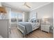 Bedroom with a white bed frame and light blue bedding and decor at 6125 Moorings S Dr, St Petersburg, FL 33712